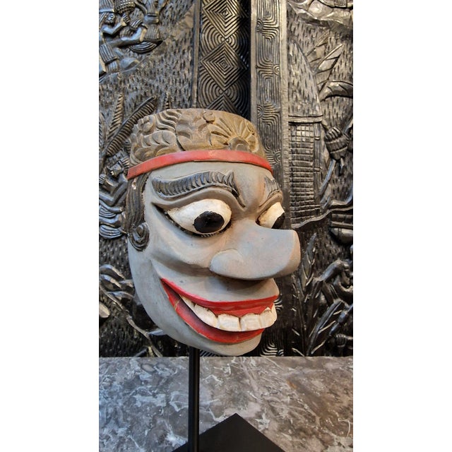 Topeng mask from the island of Bali. This hand-carved mask is used in Topeng theatre, a performance art form combining...