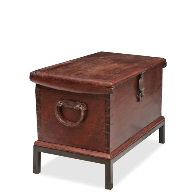Unveil the allure of the 19th century with our Antique Chest adorned with brass details, elegantly perched upon an iron...
