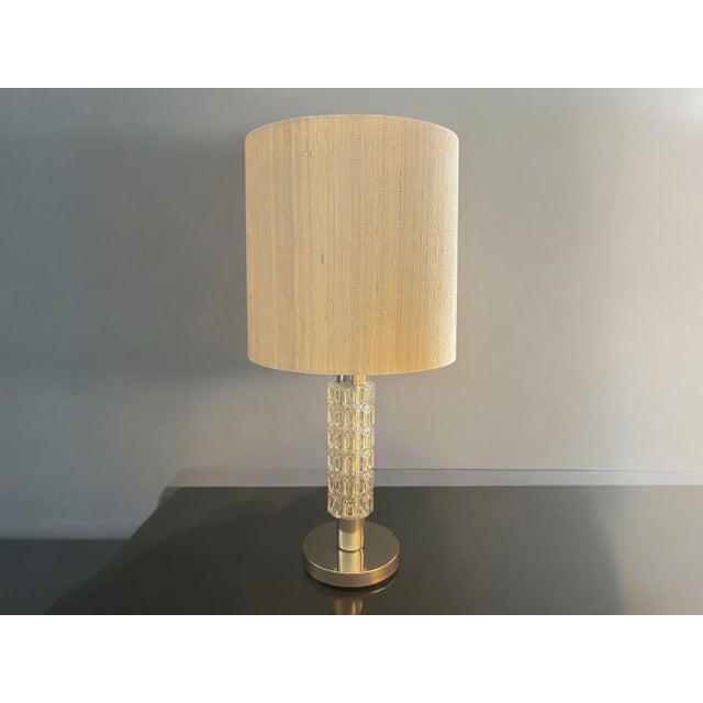 This German designer lamp from the 1960s combines the elements of the classic table lamps of earlier eras with the new...