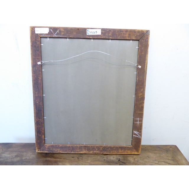 This dark silvery mirror has pewter and sienna tones and measures 26.25"H x 23.25"W.
