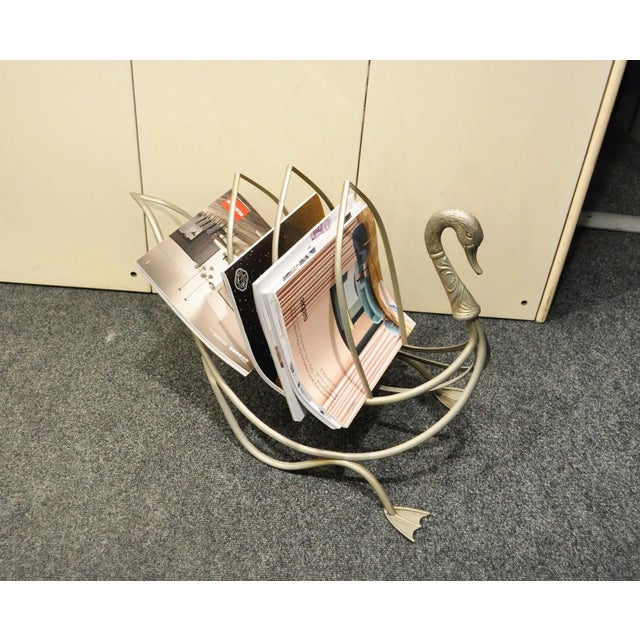 This Italian magazine rack in nickel-plated brass was produced in the 70s.