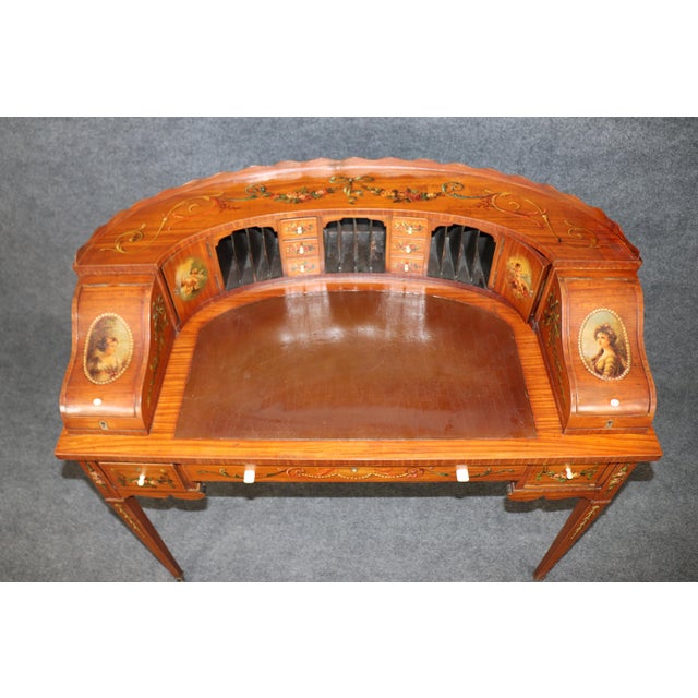 An exquisite example of late Victorian or early Edwardian fine furniture, this 1890s Satinwood Carlton House Desk embodies...