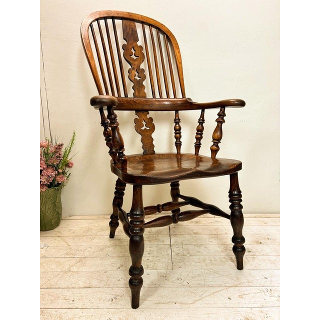 This quality Victorian Elm Antique Windsor Chair dates from ca. 1850 and has a high back with central fretted decorative...