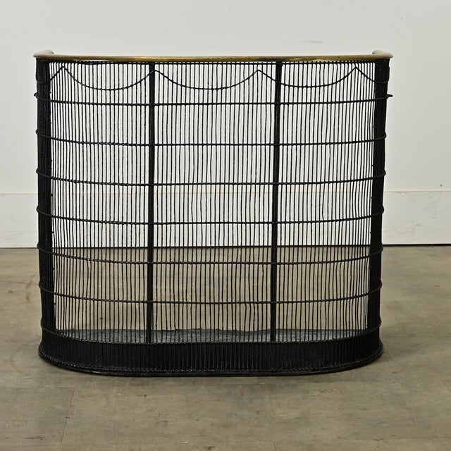 Dimensions: 21 ½” H x 25 ⅛” W x 12 ⅝” D A wonderful painted English fireplace screen or guard, made circa 1890. The...