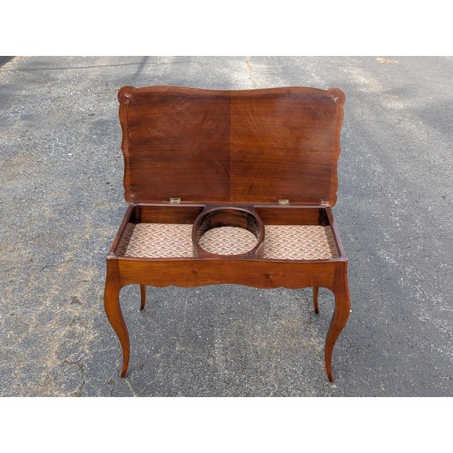 Exuding mid-century elegance and exceptional utility, this vintage solid mahogany piano bench serves as a striking...