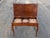 Exuding mid-century elegance and exceptional utility, this vintage solid mahogany piano bench serves as a striking...