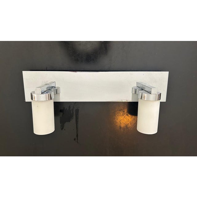 Two-light wall lamp from the publisher Massive in chrome and opaline metal, 1980s This piece has an attribution mark, I am...