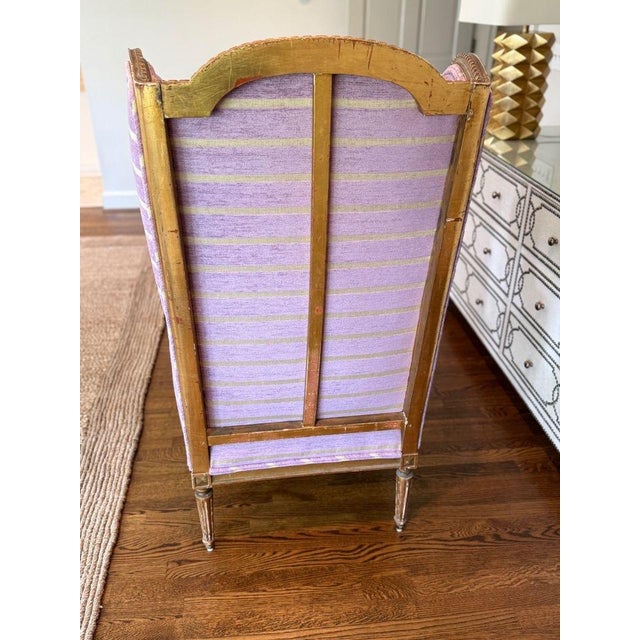 Beautiful vintage wing chair that has been given a new life with lavender chenille and creamy white fabric. Chair features...
