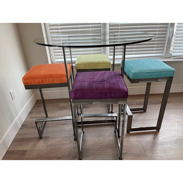 Johnston Casuals High Top Glass Table with Ultra Plush Stools with solid brushed steel construction. From barstools to...