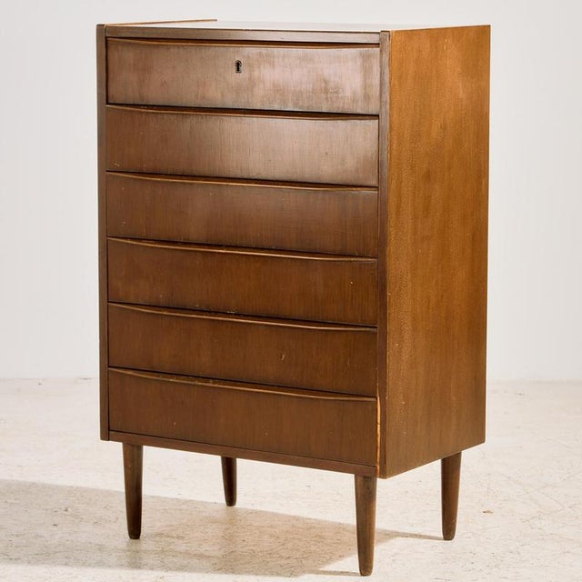 Danish teak dresser with six drawers from the 1960s. The surface of the dresser has scratches, stains and wear in places,...