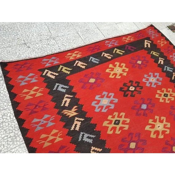 This is a vintage handwoven wool and cotton rug from Turkey. The piece was made in the 1970s.