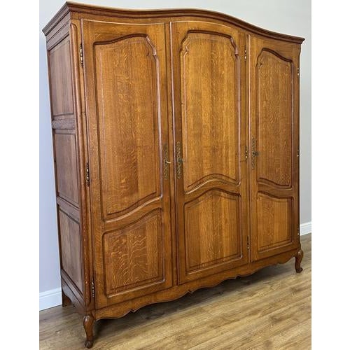 This elegant Vintage French Louis wardrobe offers timeless charm with beautifully shaped panel doors, a graceful curved...
