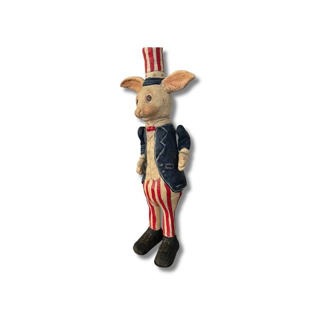 Primitive folk art figurine of a 4th of July American rabbit. This highly collectible Poliwoggs art is from 2000. It is in...