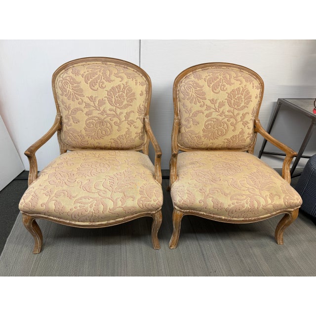 Design Plus Gallery presents a Pair of Floral Damask Bergères by William Switzer. The wooden chairs have a cerused oak...