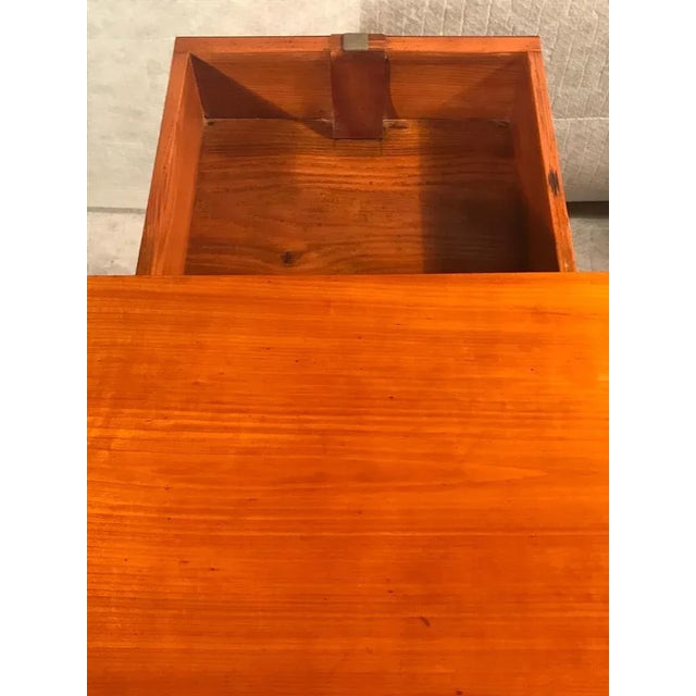 Exquisite 1820s Biedermeier Demi-lune table, boasting the timeless allure of cherry veneer. Standing gracefully on four...