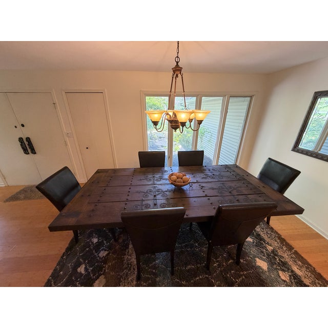 Beautiful one-of-a-kind table made from church doors. These were in a Belgian church 400 years ago. Our uncle had a custom...