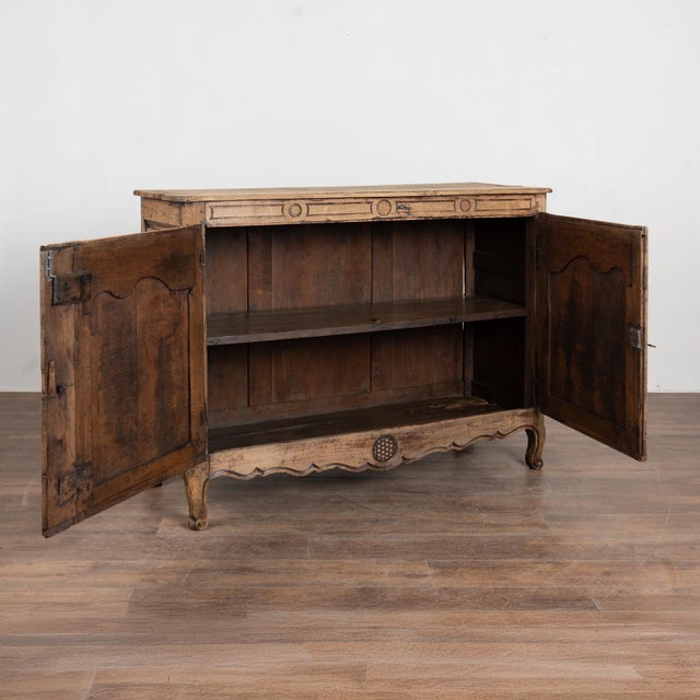 Early 19th century French sideboard crafted in oak and finished with a bleached surface, giving the wood a lighter...