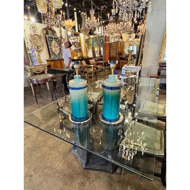 The Pair of Murano Blue Glass Column Lamps are exquisite decorative pieces that would make a stunning addition to any home...