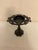 Add a touch of moody elegance and vintage drama to your interior with this striking black cast iron pillar candle holder....