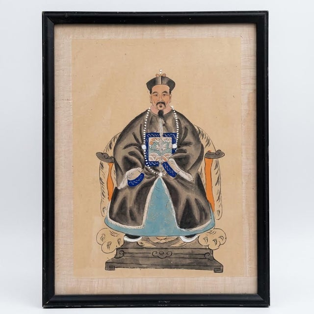 Elevate your collection with this captivating pair of antique Chinese ancestor portraits, dating from the late Qing...