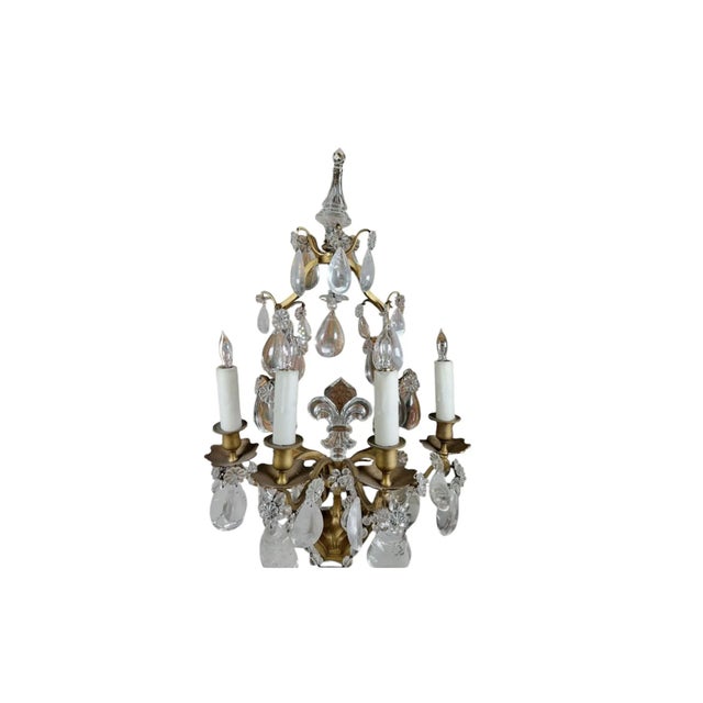 A magnificent pair of 19th century French girandoles, richly adorned with large, faceted rock crystal prisms that...