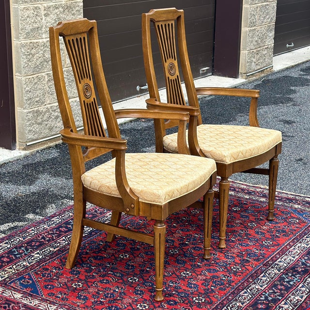 Pair of high quality arm chairs by Statesville Chair Company with fluted legs and interesting back rest detail.