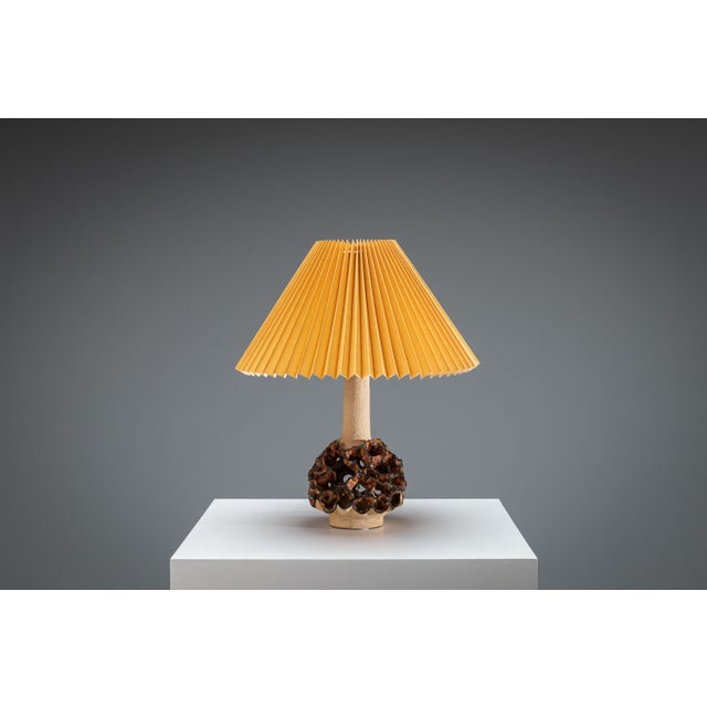 This distinctive Danish vintage table lamp carries a quiet sculptural presence, blending craftsmanship with an almost...