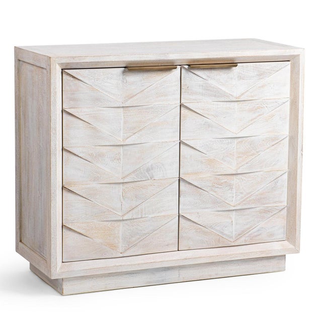 Add natural texture and distinctive style to your home with this white washed mango wood side cabinet. Featuring...