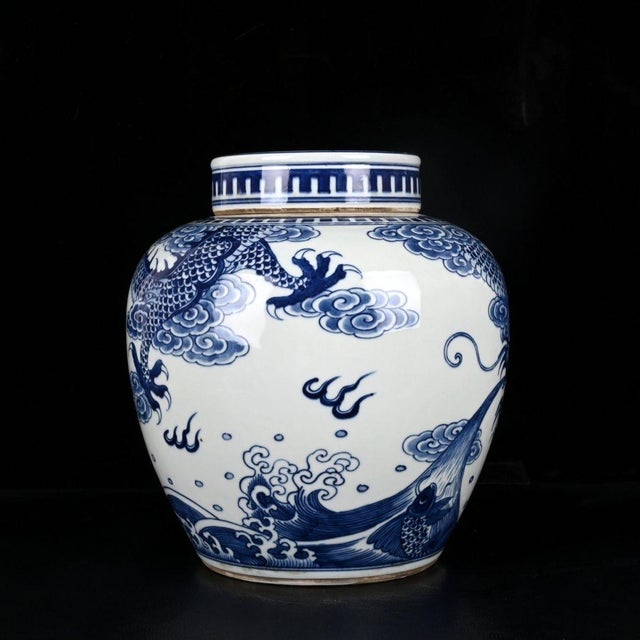 This striking vintage porcelain lidded jar features a classic, broad-shouldered baluster form. The vessel is decorated...