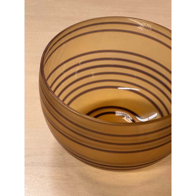 Design Plus Gallery presents a Vintage Murano Glass bowl by Roberto Faccioli for Arcade Murano. This amber glass bowl...