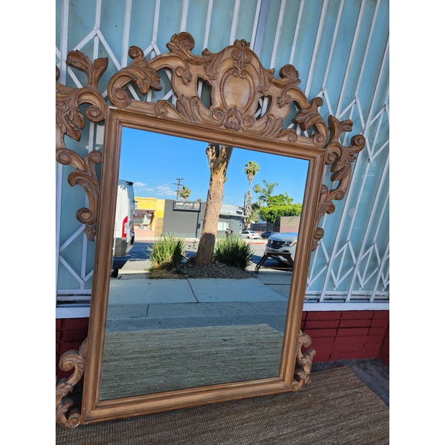 Beautiful Wall mirror with a detailed carved wood frame. Great piece for adding a touch of elegance to any room.