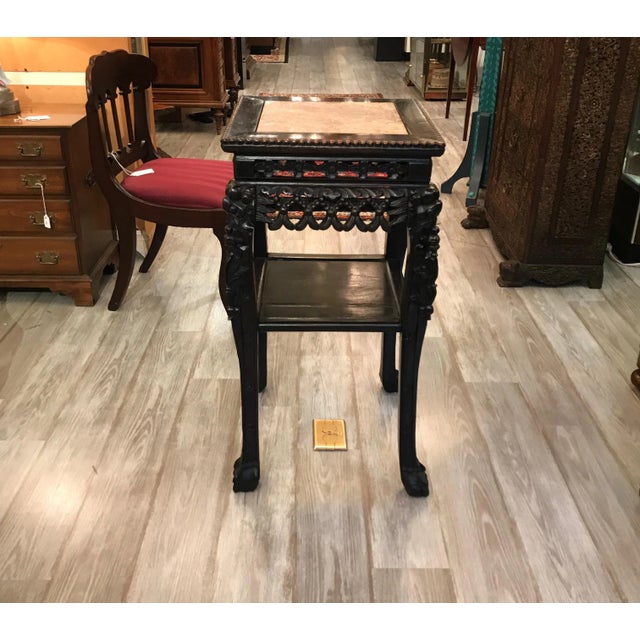 Beautifully carved hardwood square stand with marble top. Carved rosewood with a figurative rouge marble top with lower...