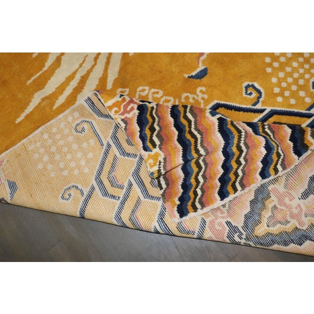 A rare wide large runner size Tibetan Dragon Pillar Rug . Background color is yellow