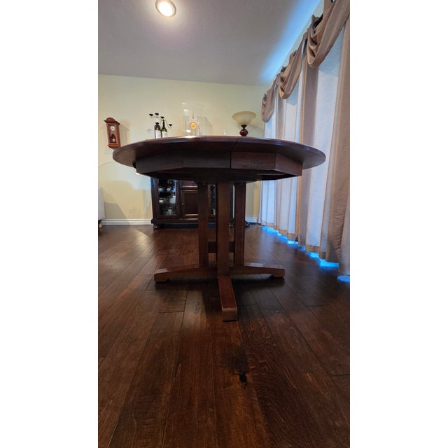 Shaker style solid cherry wood pedestal dining table with 16" expansion leaf. Made by Ethan Allen, "American Impressions"...