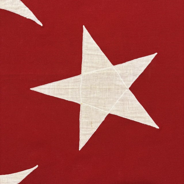 This vintage Turkish flag is made from a cotton cloth in vibrant color, with fully sewn star and crescent visible on both...