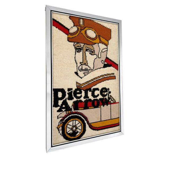 A vintage 1970s "Pierce Arrow" Motor Car Company needlepoint, depicting an art deco 1930s car scene. Silver metal aluminum...