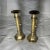 Pair of brass candlestick holders with a brass bow design. Both have been polished. The candlesticks come apart easily for...