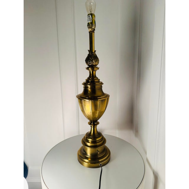 Large fine solid brass table lamp is genuine Stiffel and features an amazing Hollywood Regency style palm circa the 1920s....