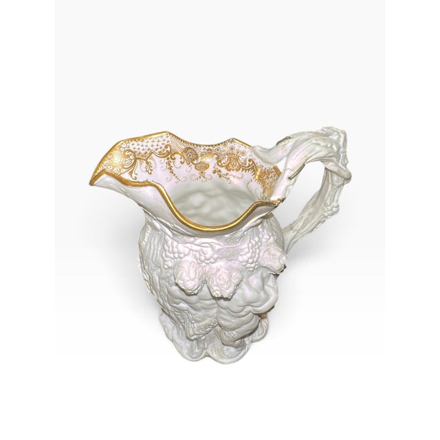 Rare mid-19th-century French relief-molded porcelain Silenus/Bacchus pitcher attributed to Jacob Petit, circa 1850....