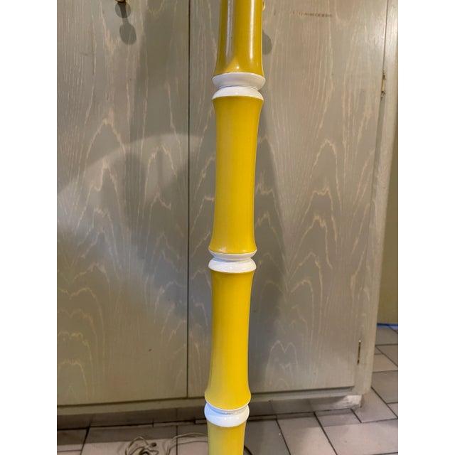 Mid Century Yellow Floor Lamp w/Shade Plastic like? shade with yellow ribbon trim Looks like high gloss lacquered wood w a...
