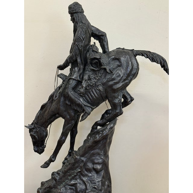 This 41-inch "mega-sized" bronze of Frederic Remington’s Mountain Man is almost certainly a modern reproduction. While an...