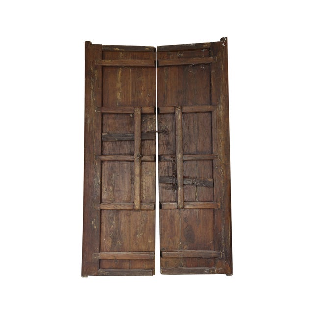 This exquisite set of two 18th Century French carved wooden stained doors showcases the elegance and craftsmanship of an...