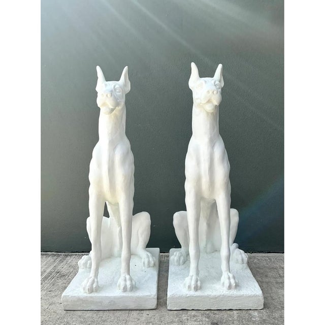Sculpted with remarkable realism and monumental scale, this pair of vintage solid cast cement Great Dane statues captures...