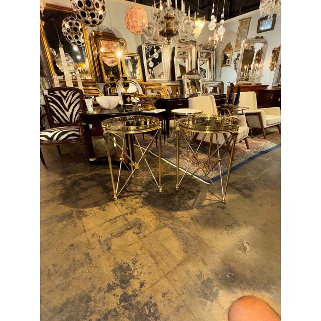The pair of Jansen Design steel and brass side tables are classic style table that create a polished look in any home....