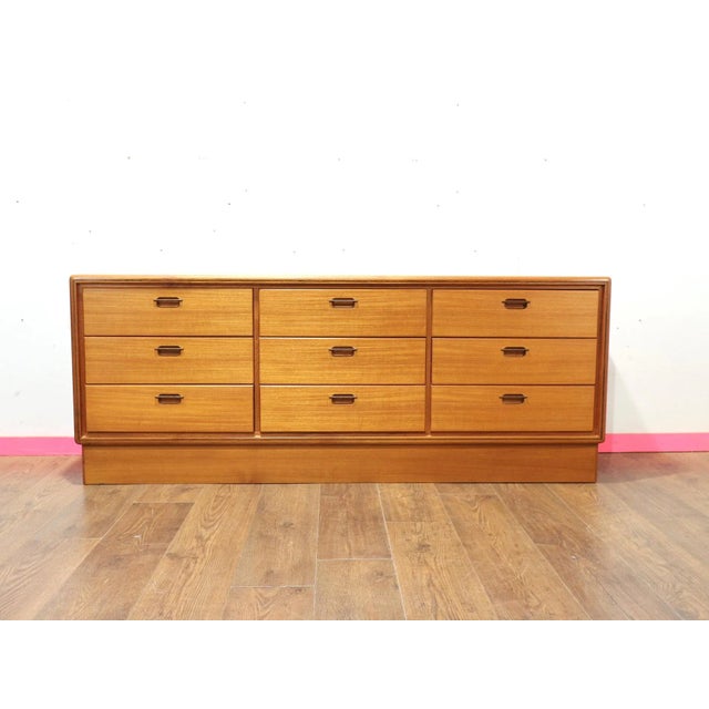 At Mid Century Traders, discover our sophisticated Mid Century Danish dresser bank of drawers. This striking piece offers...