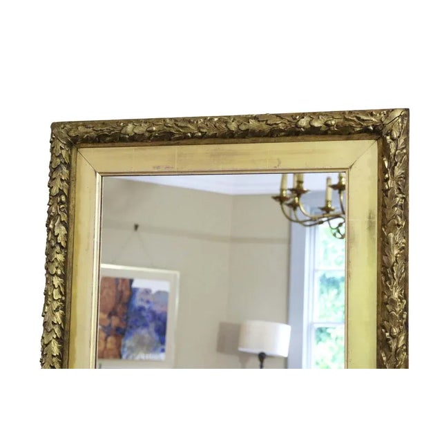 Antique 19th Century large gilt overmantle wall mirror of fine quality, adorned with a decorative oak leaf design. This...