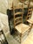Two solid ladderback chairs with great character. One chair measures 44" high, the other 42.5" high—similar style,...