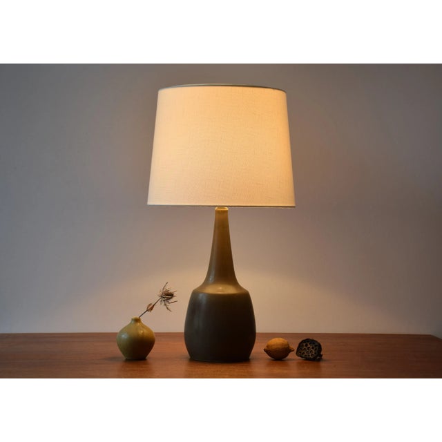 Tall Mid-century Danish table lamp from ceramic workshop Palshus. The lamp was designed by Per Linnemann-Schmidt and...