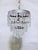 A beautiful expression of vintage elegance, this charming crystal chandelier features an ornate silver frame embellished...
