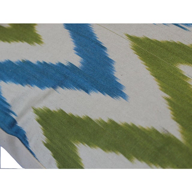 Bohemian silk ikat pillow with vibrant colors of red, beige and blue. Super hand soft. Pillow has a zipper for closure....